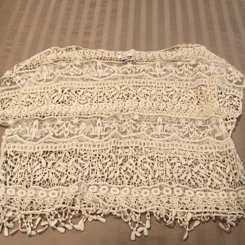 Cream crochet style sheer top with fringe bottom